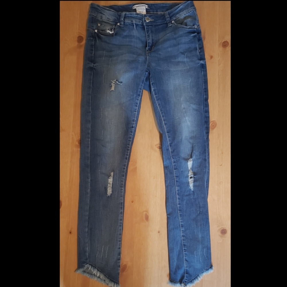 Revamped denim distressed mid rise jeans